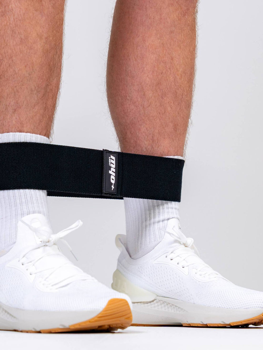Banded walks (Light): Athlete using Myoband Light resistance band for ankle activation