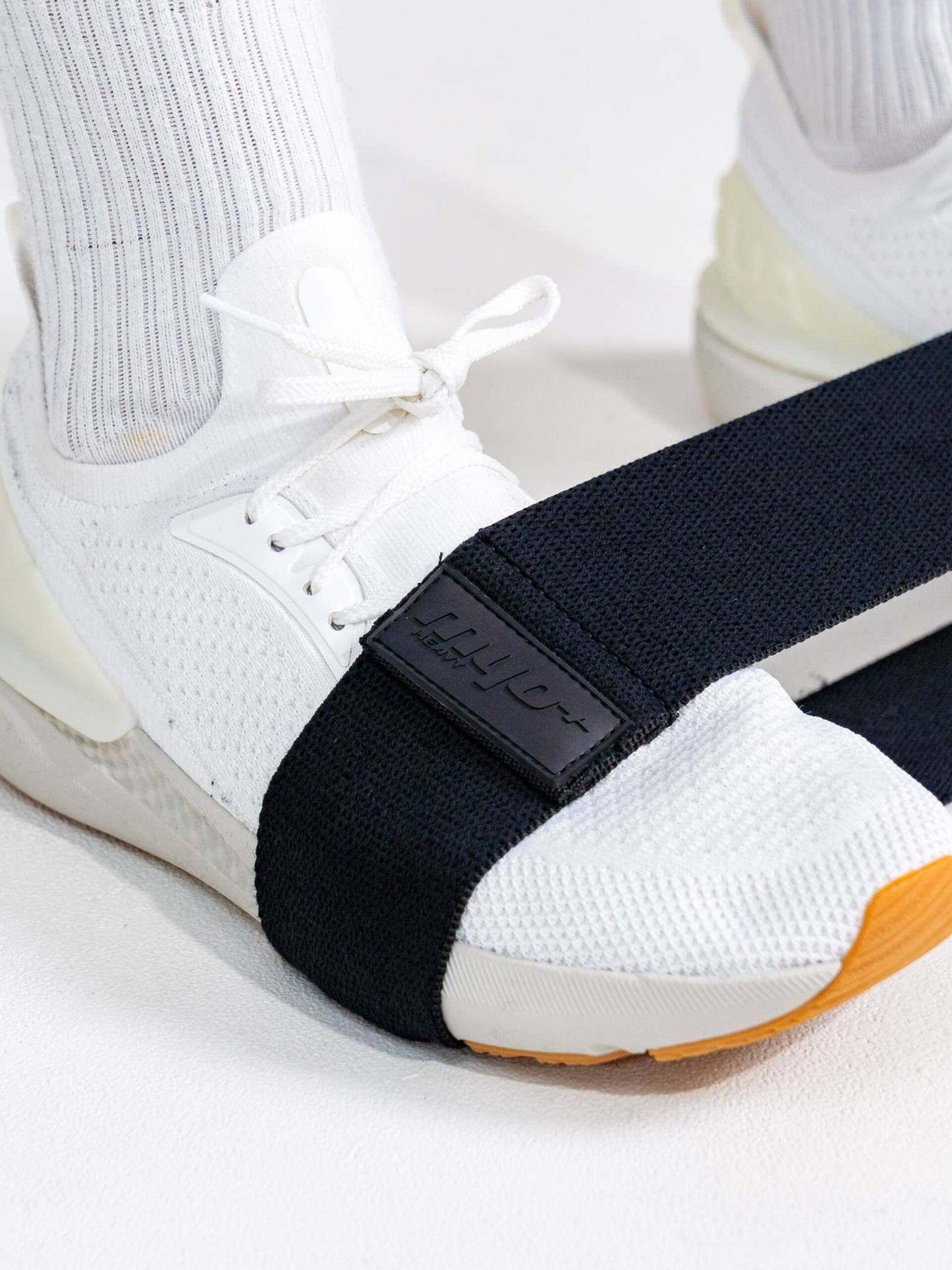 Foot anchor (Heavy): Athlete using Myoband Heavy for foot-anchored resistance work