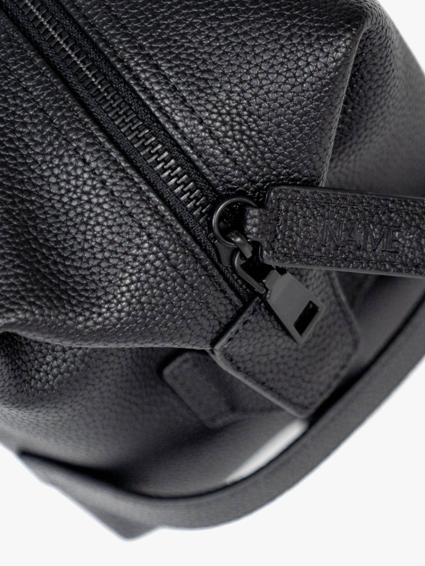 Personalised NAME tag detail on the Myo+ leather recovery bag zipper